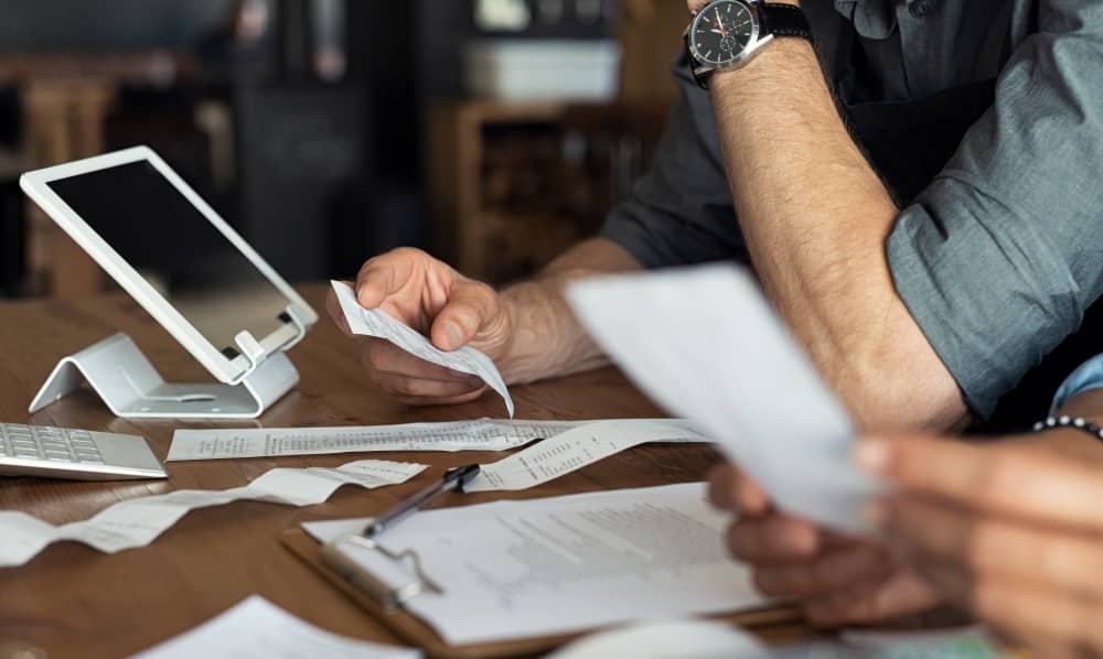 A bookkeeper organising receipts of expenses.