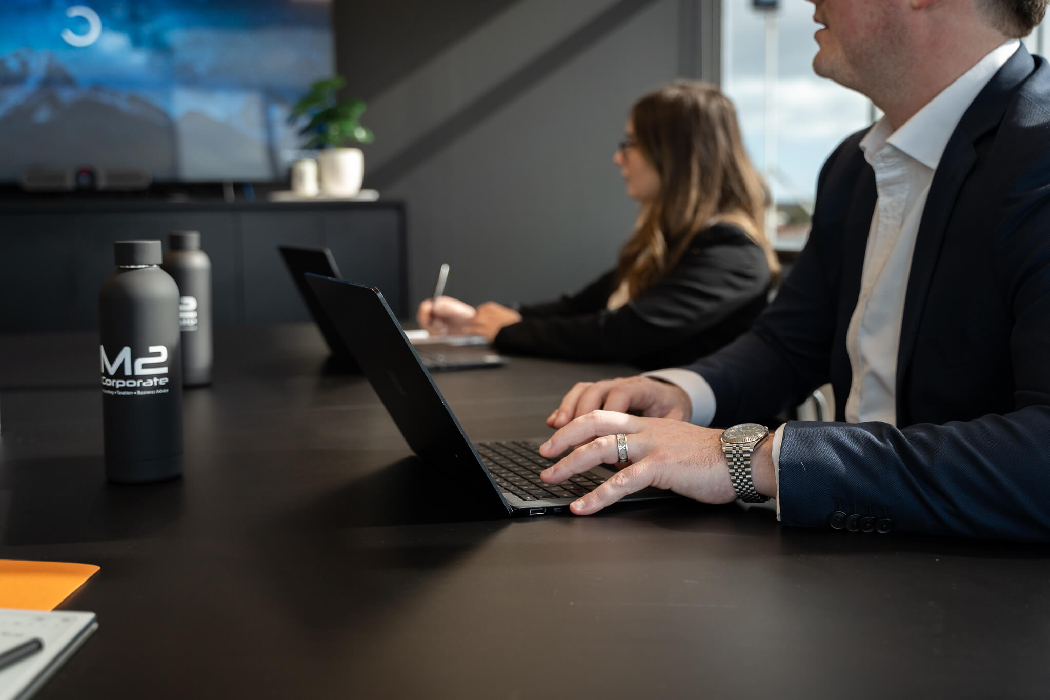 Team of business advisors and business accountants at a meeting table with the CFO