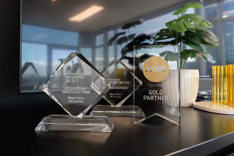 Three accounting awards for M2 Corporate on a desk