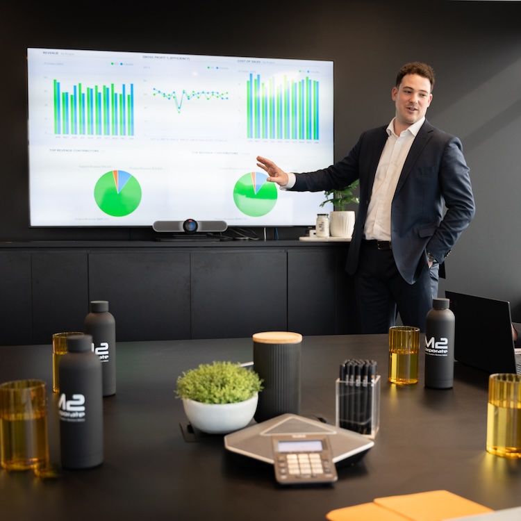 Mace Turco showing a graph as part of his business succession planning services