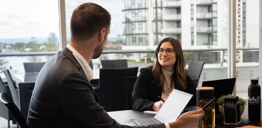 Business advisor explaining the small business restructure rollover to a client