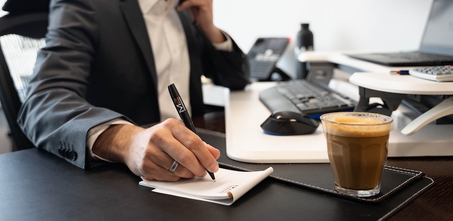 Outsourced CFO writing a note explaining what they are and what they do