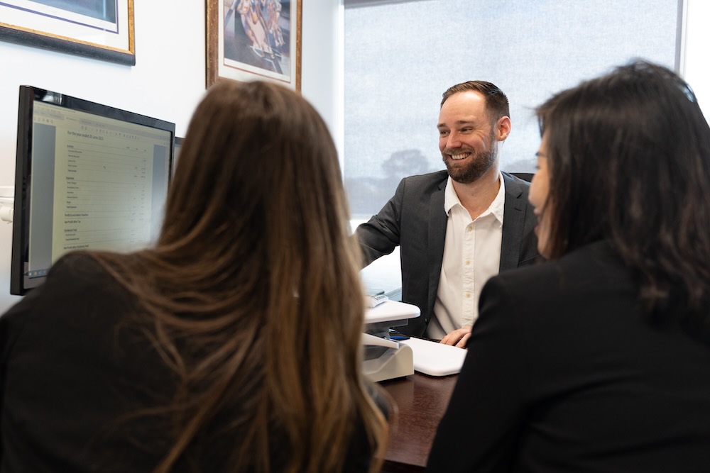Accountant instructing a small business how to set up Xero